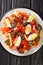 Pique macho is a very popular dish from Bolivia made of beef cuts and fried sausages with fries, eggs, chili peppers and tomatoes