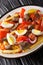 Pique macho is a very popular dish from Bolivia made of beef cuts and fried sausages with fries, eggs, chili peppers and tomatoes