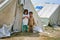 Pir Sabaq Village, KPK, Pakistan. September 6, 2010: Poor Children standing outside their camp