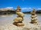 Piramide stack of zen stones near sea and blue sky