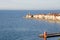 Piran Picturesque seaside old town in Slovenia against snow covered mountains in winter.