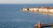 Piran picturesque seaside old town in Slovenia against snow covered mountains in winter.