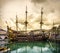 Pirate sailing ship galleon sailer Genoa port yellow storm cloudscape Liguria Italy