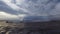 Pirate Ship Inside Message Bottle Floating Against Stormy Sky And Rain