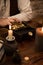 Pirate with a treasure of gold, medieval table with candles, quill and a mug