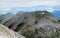 Pirin mountains in Bulgaria, gray rock summit during the sunny day with clear blue sky