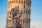 Pisa - The angles sculpture and Hanging tower in evening light