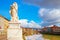 Pisa, Arno river, lion statue and buildings reflection. Lungarno view. Tuscany, Italy