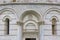 Pisa Baptistery of St. John, decorative details of facade, Piazza del Duomo, Pisa, Italy.