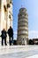 Pisa, Italy - March 17, 2012: People taking photo near the Tower of Pisa Torre di Pisa