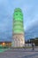 PISA, ITALY - MARCH 17, 2019: Pisa Tower for St Patrick`s Day illuminated by green lights