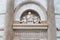 Pisa leaning tower statues above the entrance door