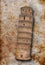 Pisa tower on old damaged antique background