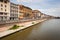 Pisa town with river embankment and river Arno