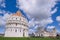 Pisa, Tuscany, Italy, April 05, 2019: Many tourists visit Piazza Dei Miracoli with the famous Leaning Tower and dome