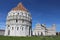 Pisa, Tuscany, Italy - May 16, 2019: the Baptistery, the Dome and the Leaning Tower of Pisa in Piazza dei Miracoli