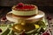 Pistachio cheesecake with raspberry jelly on cake stand