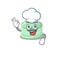 Pistachio macaron cartoon character working as a chef and wearing white hat