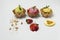 Pistachio pation fruit and strawberry ice creams on white background with accompanying fruits