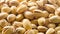 Pistachios. Nuts close - up video in high quality. Slow motion camera, a smooth approximation of the background nuts with the blur