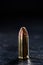 Pistol cartridge on a dark background