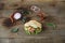 Pita - sandwich, sabiche stuffed with chicken, tomatoes, cucumbers, salad on a wooden rustic background