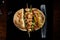 Pita stuffed with chicken, vegetables, kebab, sause on plate on wooden background, top view, selective focus.