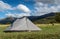 Pitched Tent with Mountains in background