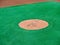 Pitcherâ€™s mound of a baseball diamond awaiting pitcher