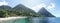 The Piton mountains Gros Piton and Petit Piton in a lush green forest next to the blue ocean on Saint Lucia Island in the Caribbea