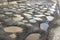 Pits on a gravel road with mud and puddles in spring in Russia