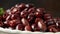 Pitted kalamata olives in bowl on rustic wooden background