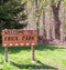 Pittsburgh, Pennsylvania, USA April 11, 2021 A wooden Welcome to Frick Park sign at it`s entrance in Regent Square