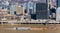 Pittsburgh, Pennsylvania, USA February 20, 2022 A tow boat pushing four barges up a muddy Monongahela River