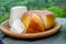 pitu unpasteurised cow\\\'s milk cheese and smoked cow milk cheese From Pria, Asturias served outdoor with apples