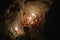 Pixie gang eating a Christmas meal in an underground den, only with light from the candles