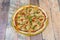 Pizza alla Parmigiana, made with tomato, oregano, pomodorini, fresh
