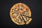 Pizza barbecue with cornichoni olives peperoni cheese mozzarella on black stone background