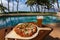 Pizza and beer by the poolside in Hawaii