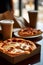 Pizza in a cardboard box and coffee, blurred background