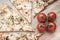 Pizza, cherry tomatoes on a light wooden background