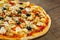 Pizza with Chicken meat, Mozzarella cheese, tomato, olive. Italian pizza