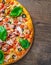 Pizza with Chicken meat, Mozzarella cheese, tomato, olive. Italian pizza on wooden