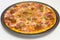 Pizza with chorizo, salami, bacon, onions and olives