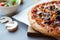 Pizza composition on wooden table with gray background hand.