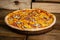 Pizza with corn, ham and mushrooms