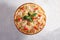 Pizza with crab, shrimp, cherry tomatoes and basil