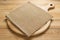 pizza cutting board and napkin at rustic wooden table