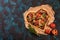 Pizza heart love Valentine`s Day romantic Italian restaurant dinner food. Prosciutto, olives, tomatoes, parsley, basil