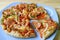 Pizza with Italian Sausage, Bell Pepper, Onion and Cheese Served on Big Blue Platter